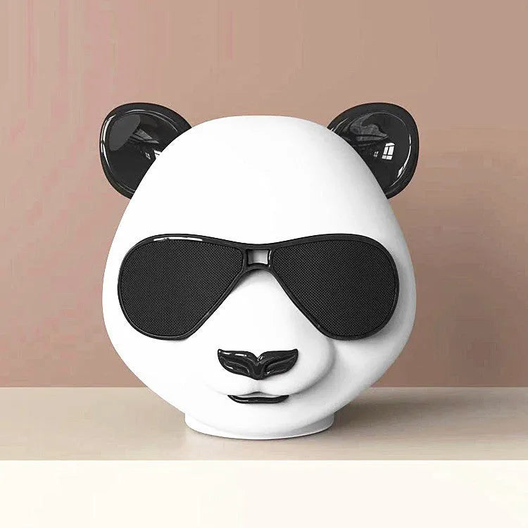Classic style portable mini Bluetooth speaker shown on a table.