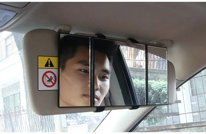 Silver car folding makeup mirror shown both closed at 15.5cm and open at 30.5cm wide.