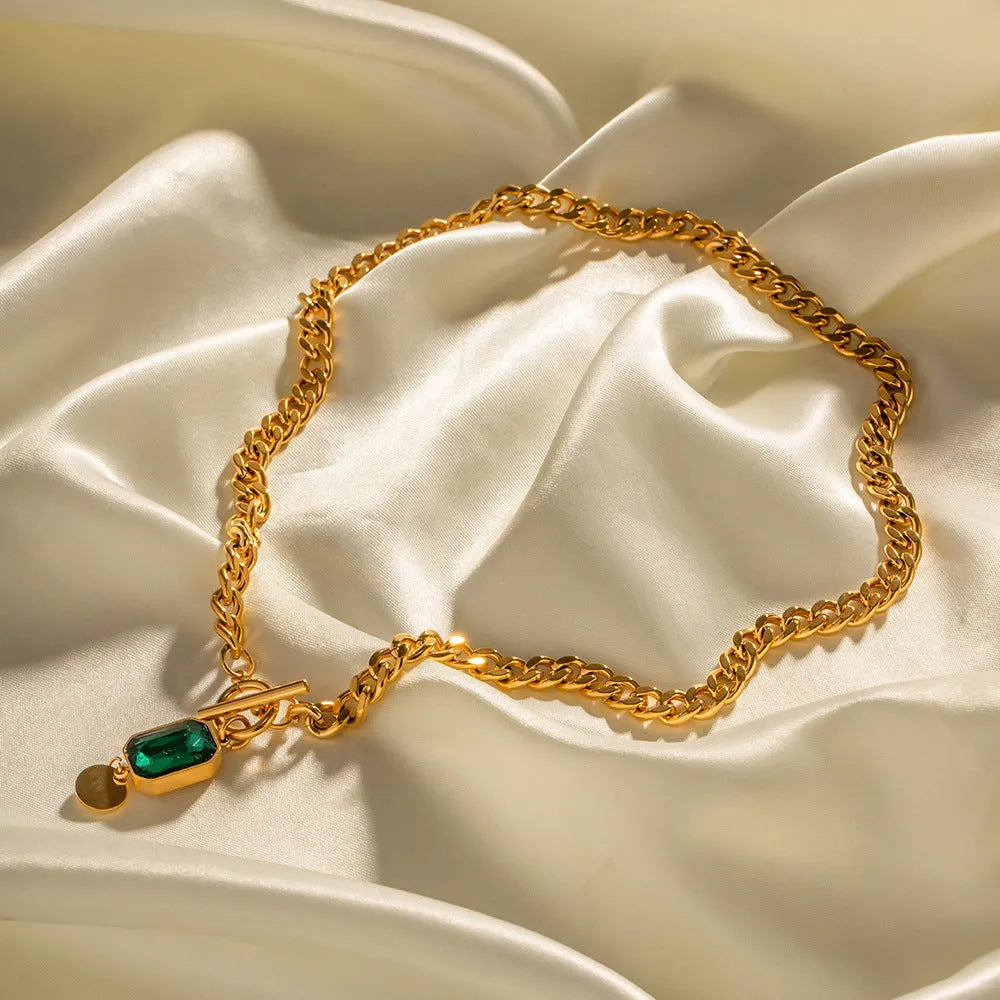 Gold electroplated titanium steel necklace with geometric round pendant and Cuban link chain