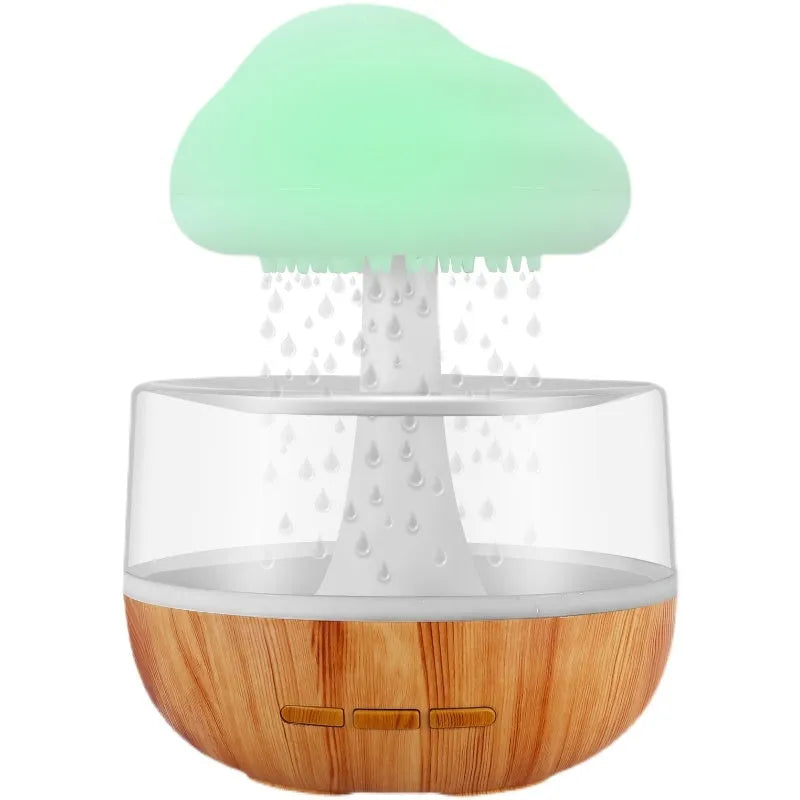 White raining cloud-shaped humidifier with night light and water drop essential oil diffuser.