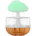 White raining cloud-shaped humidifier with night light and water drop essential oil diffuser.
