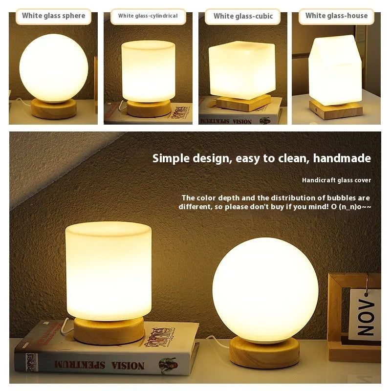 Nordic solid wood USB table lamp in a geometric shape on a wooden surface.