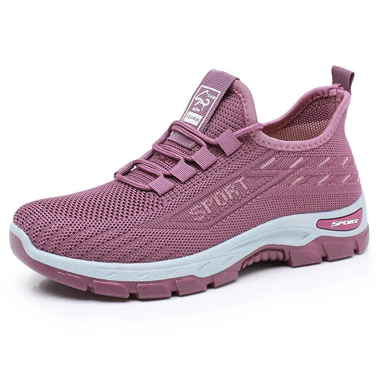 Low-top casual sneakers with a round toe and PVC sole, shown in available colours for men and women.