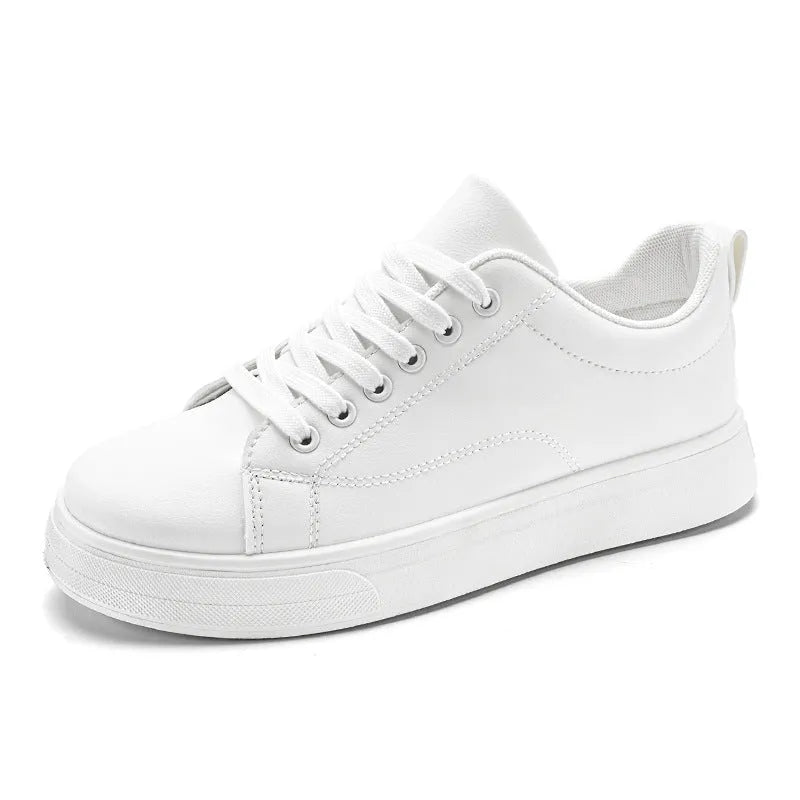Men's low-top Korean-style sneakers in white, black, or black and white with a round toe and rubber sole.