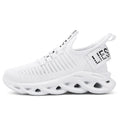 Children's fabric sneakers with Velcro strap in black, khaki, and white colours on a neutral background.