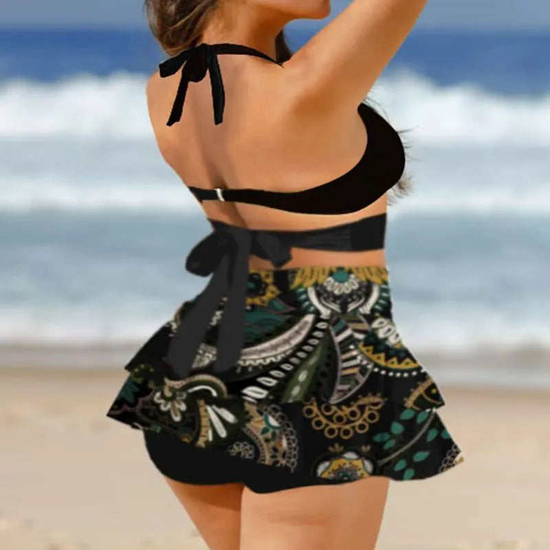 Women's purple bikini swimsuit with matching skirt featuring high waist briefs and lace-up design