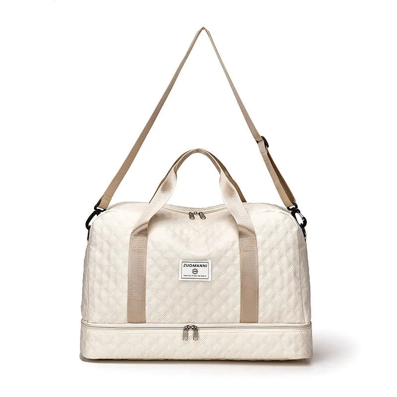Oxford cloth travel bag in a solid colour with sewing thread detail, shown with 36-55L capacity.