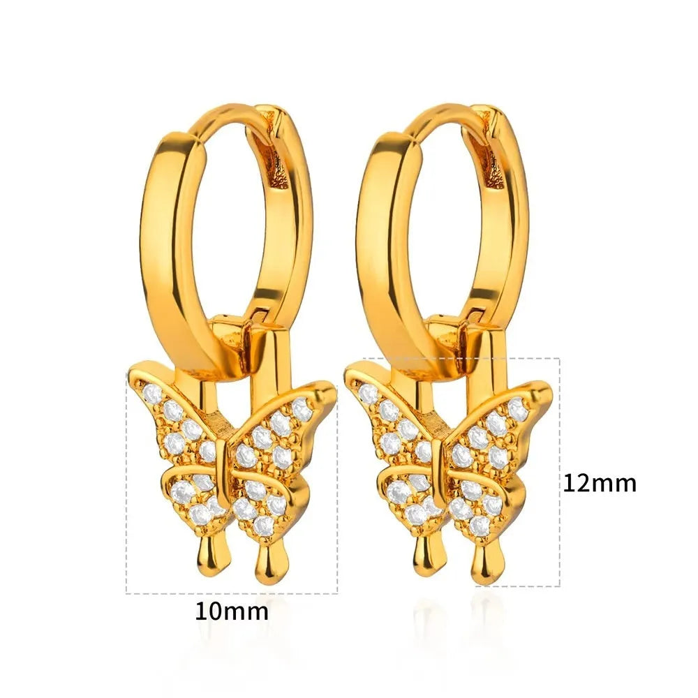 Women's copper butterfly earrings with geometric heart, star, and bow shapes and cubic zirconia stones.