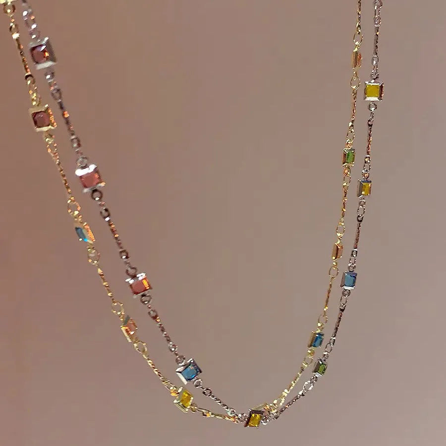 Square geometric clavicle chain necklace in gold or white K tone with alloy and artificial crystal.
