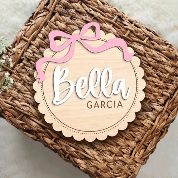 Customised square wooden baby ornament with a name for birthday or holiday decoration.