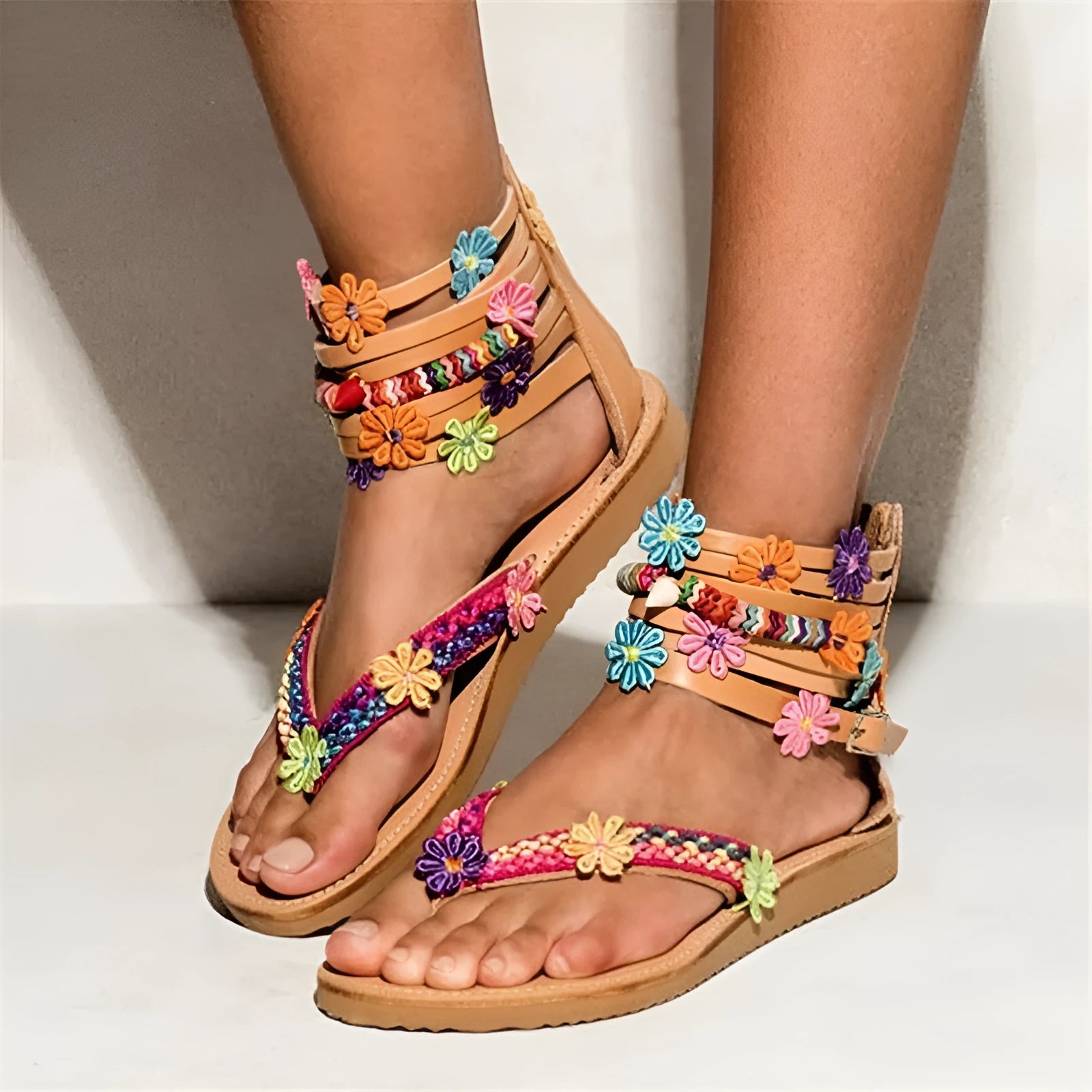 Women's beaded petal floral sandals with ethnic design on a light background.