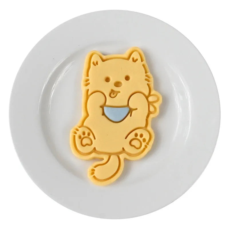 Three-dimensional plastic biscuit mould with puppy cartoon designs for making decorated dog-themed cookies and candies
