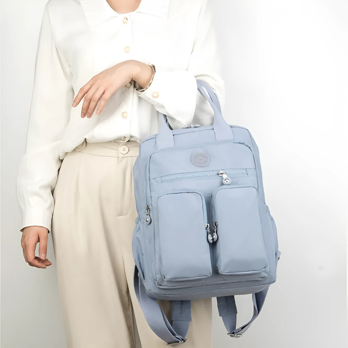 Women's large waterproof nylon travel backpack in lotus root purple showing internal laptop and camera compartments.