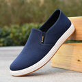 Men's black slip-on canvas cloth shoes with round toe and injection moulded sole