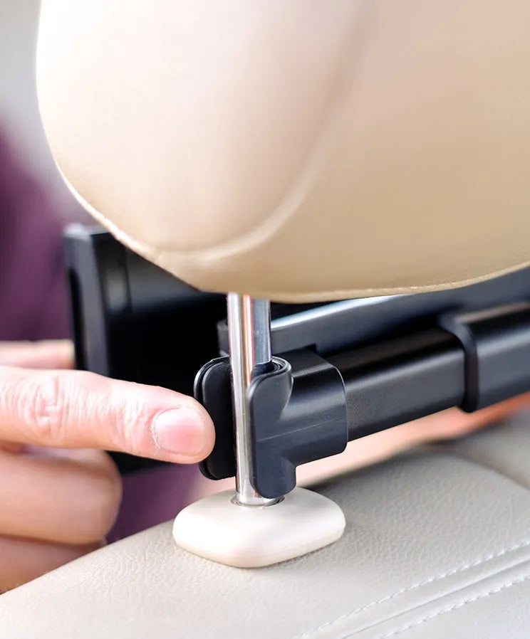 Black plastic universal car phone holder mounted on a car rear seat base.