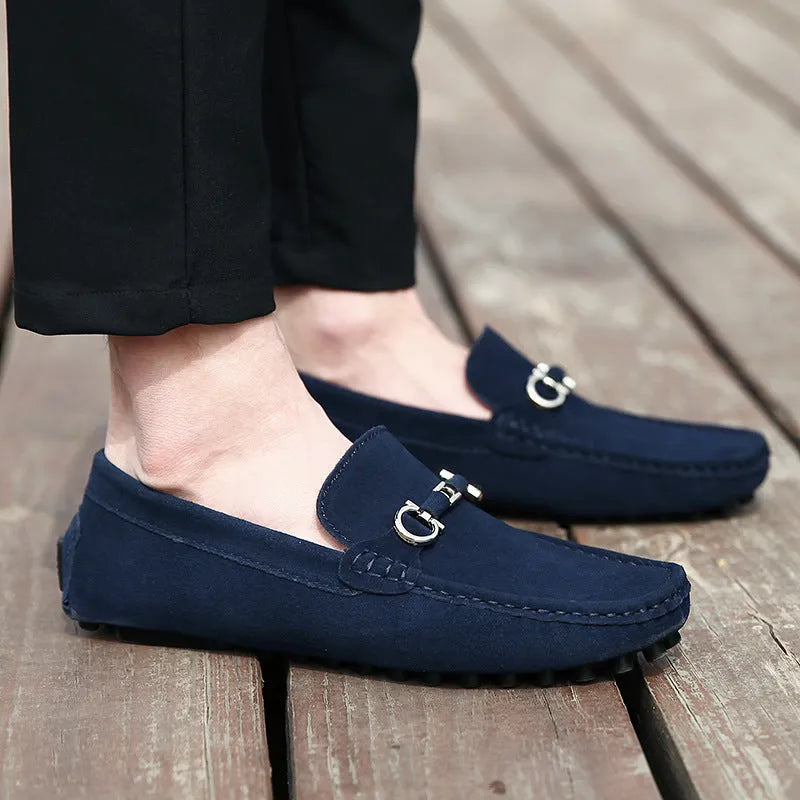 Men's black matte cowhide leather slip-on loafers with a square toe and flat rubber sole.
