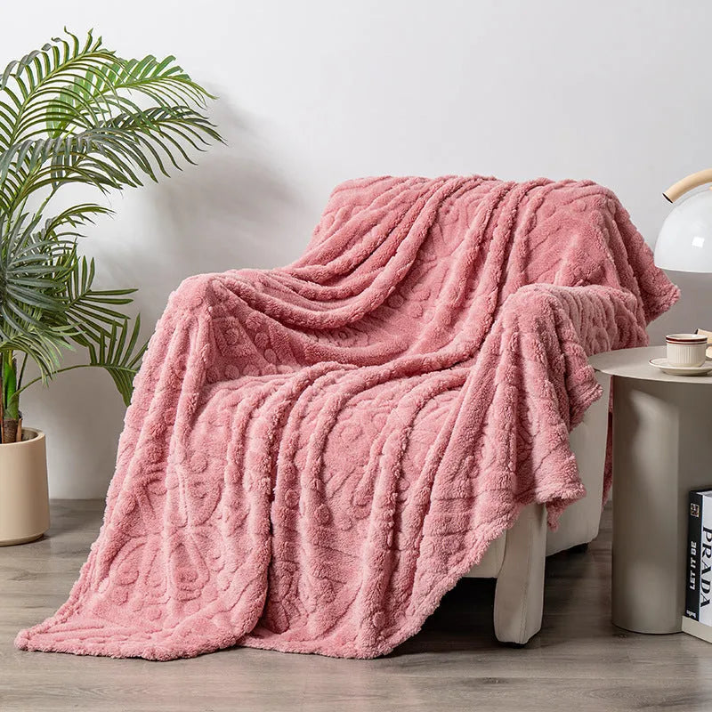 Shu cotton velvet jacquard blanket in a solid colour with a woven plant flower pattern, shown in one of five available colours.