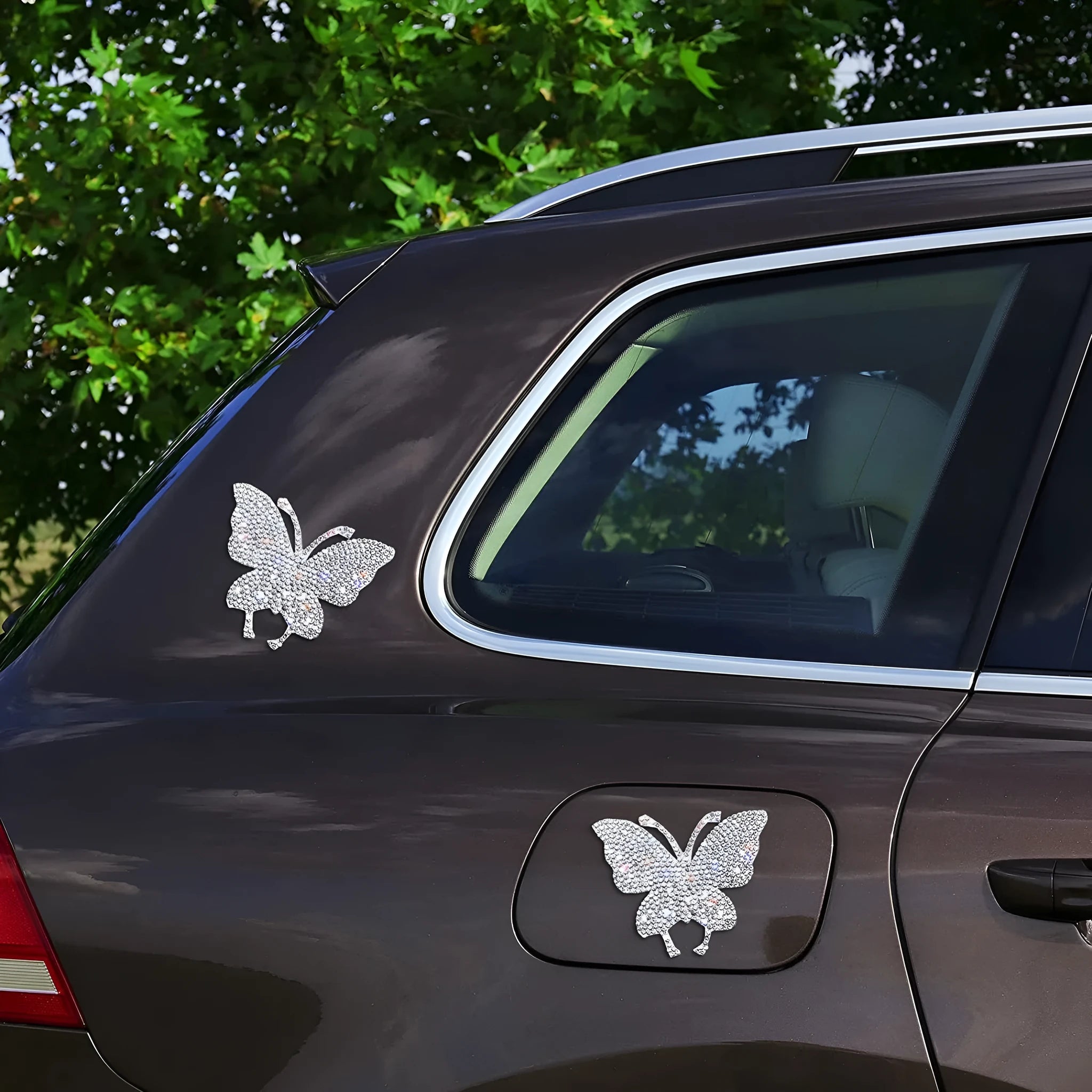 Close-up of white diamond series glass car sticker featuring butterfly and bear paw design measuring 7cm by 6cm