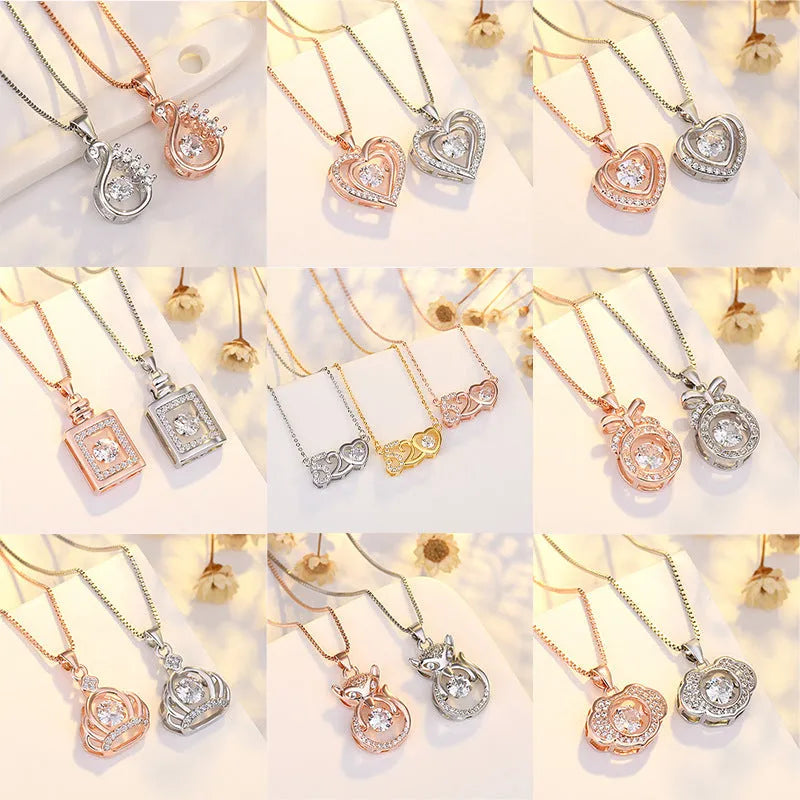 Sterling silver heart pendant necklace with crown and bow detail in rose gold or silver colour options