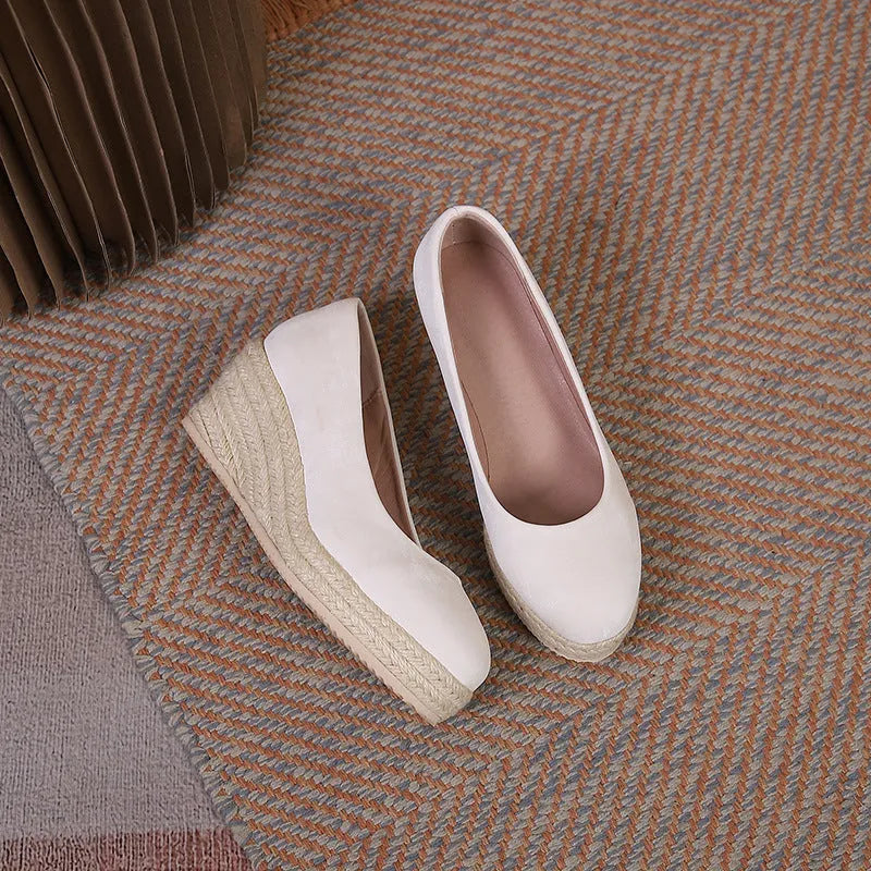 Women's wedge heel pumps with thick platform sole and rope detail at heel in apricot.