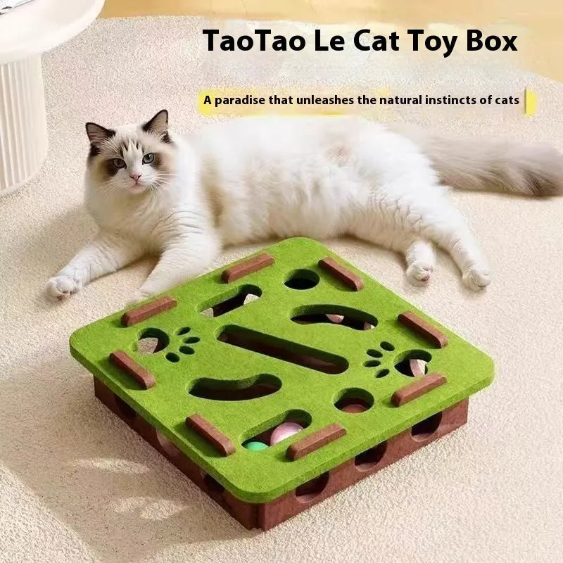 Green brown felt square cat toy with a hole in the centre on a wooden floor.