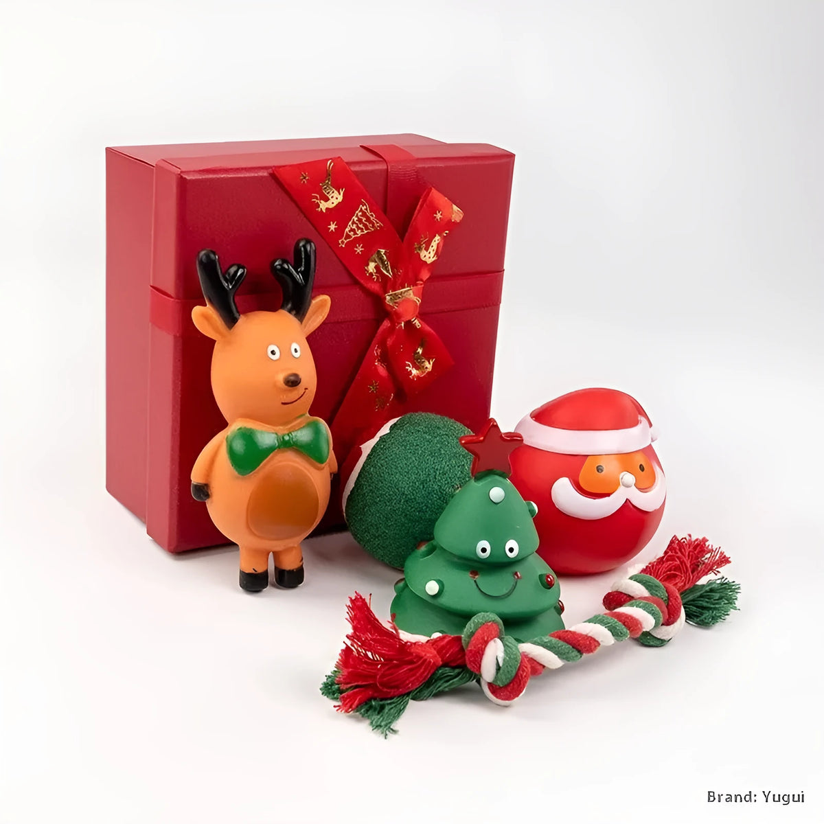 Christmas-themed vinyl dog toys including bite ropes, tennis balls, Santa heads, and deer figures in gift packaging