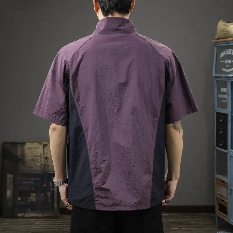 Man wearing a brown half-zip stand collar short sleeve shirt made of Ice Silk fabric.