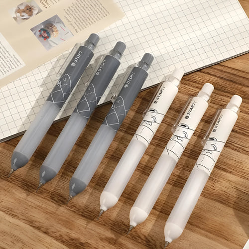 Black and white 0.5mm mechanical pencils with triangular cloud grips on a minimalist background.
