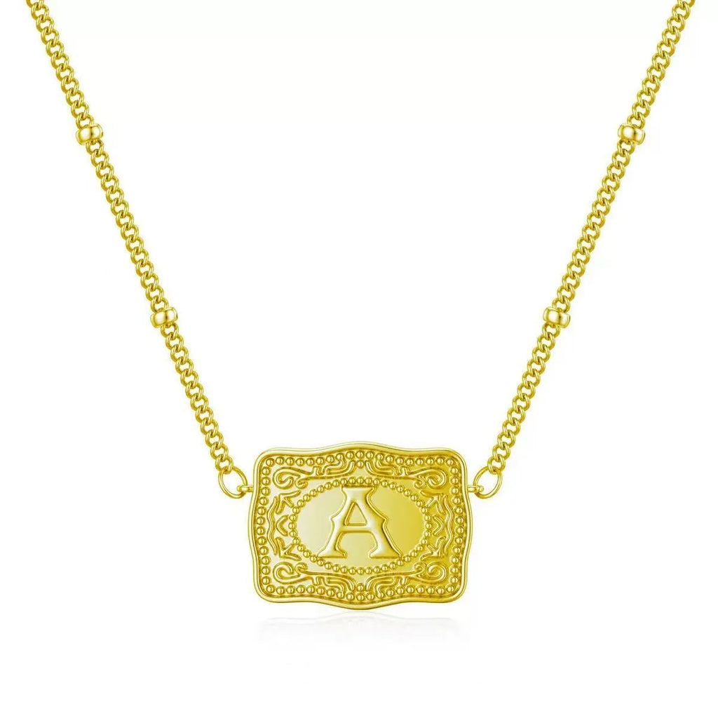 Copper initial letter necklace with electroplated gold or white K finish on a chain.