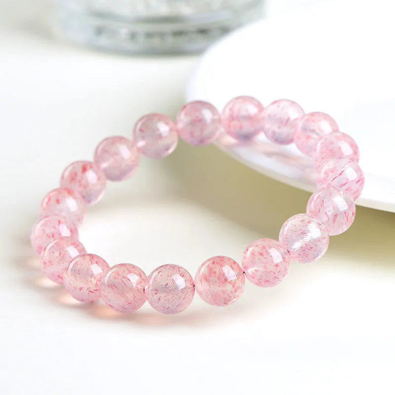 Natural white water strawberry quartz crystal ball bracelet with 19 polished 10-10.8mm beads.