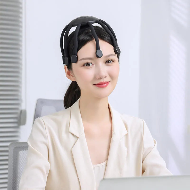Black USB head massager with eight silicone claws for scalp vibration therapy