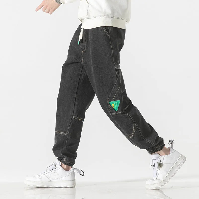 Men's loose-fit tapered cotton trousers in black, blue or grey with mid-waist design