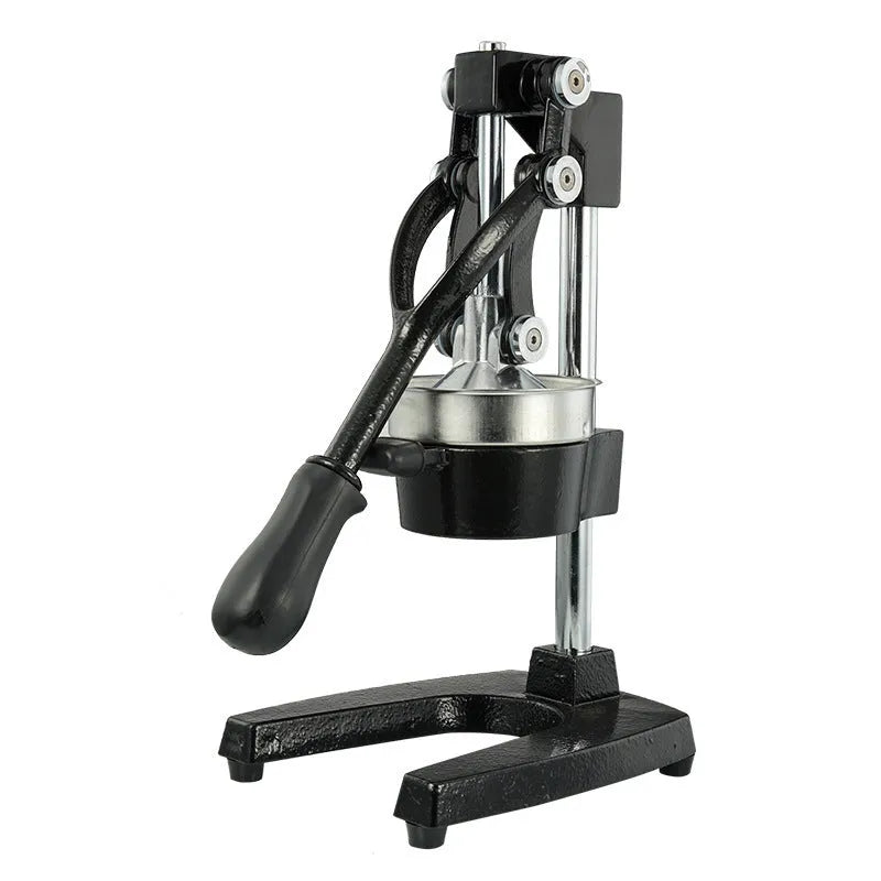 Tall black cast iron manual citrus juicer with stainless steel funnel on a kitchen counter.