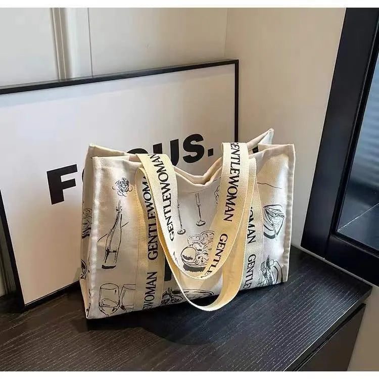 Large canvas tote bag with printed design, shown in available colour and pattern options.