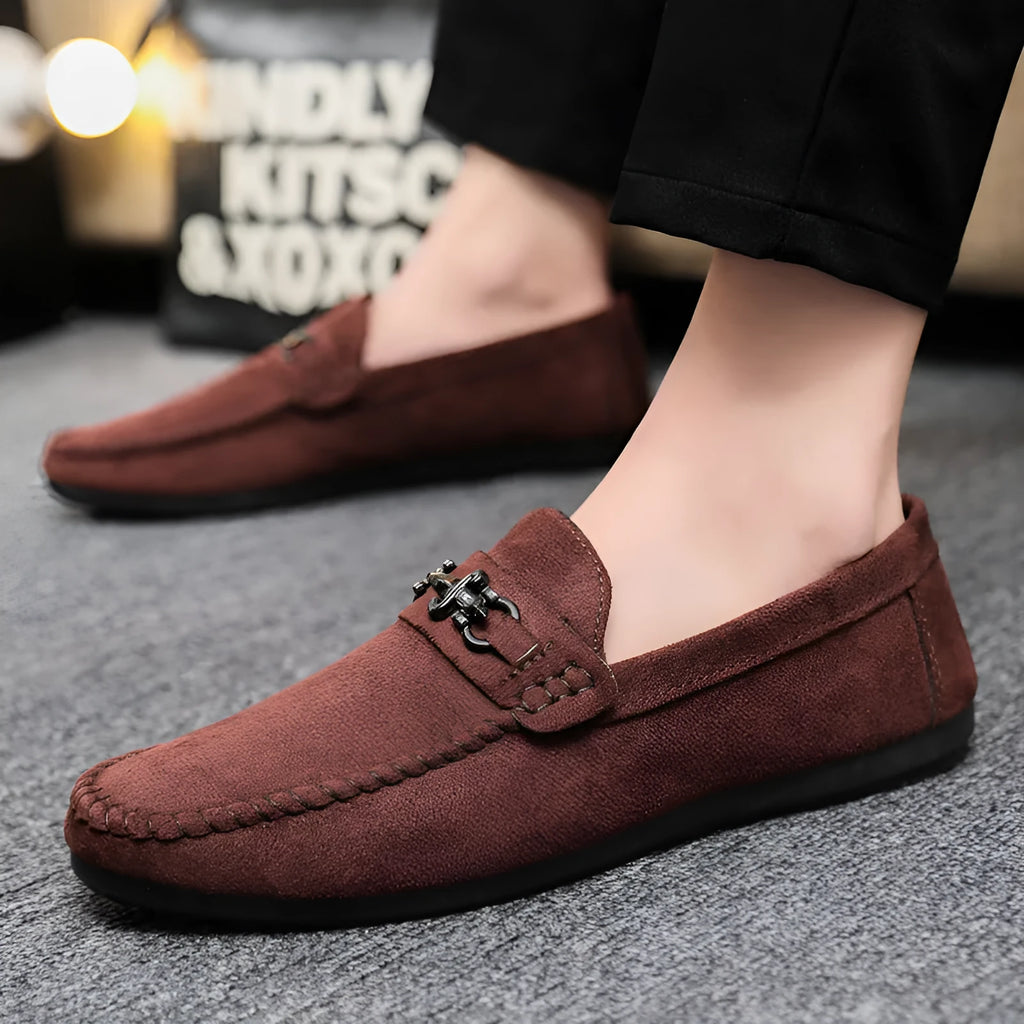 Men's black and brown waterproof slip-on loafers with round toe and rubber sole.