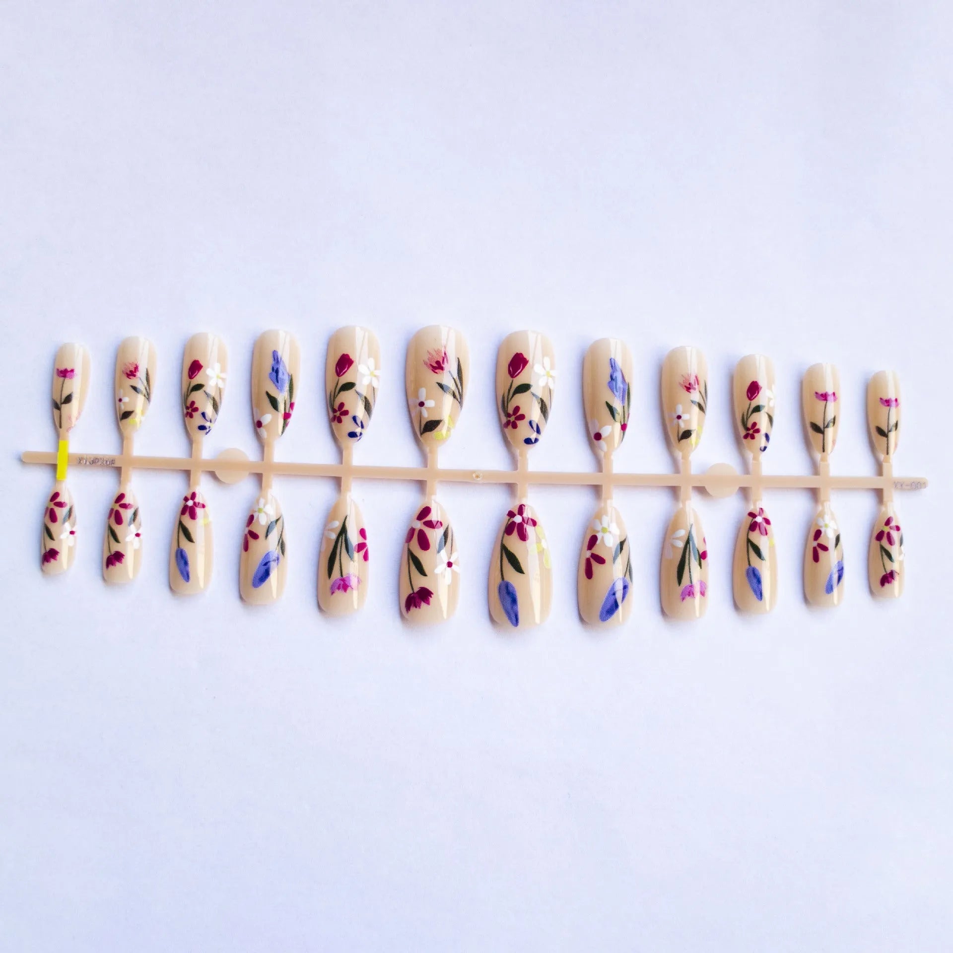 Almond-shaped removable nail art with floral patterns including roses and tulips