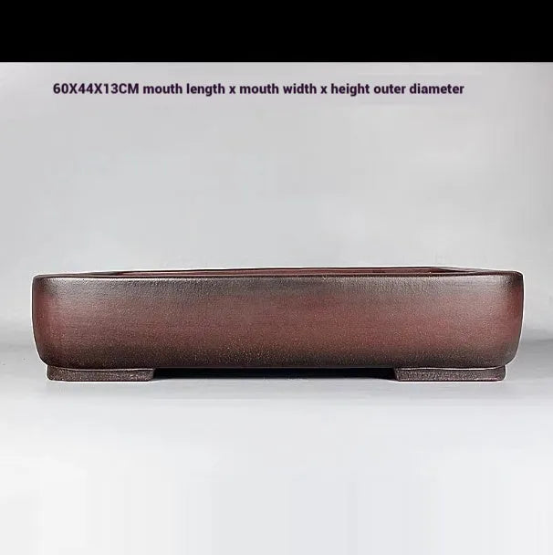 Handmade rectangular antique purple clay flower pot showing its size and textured finish.