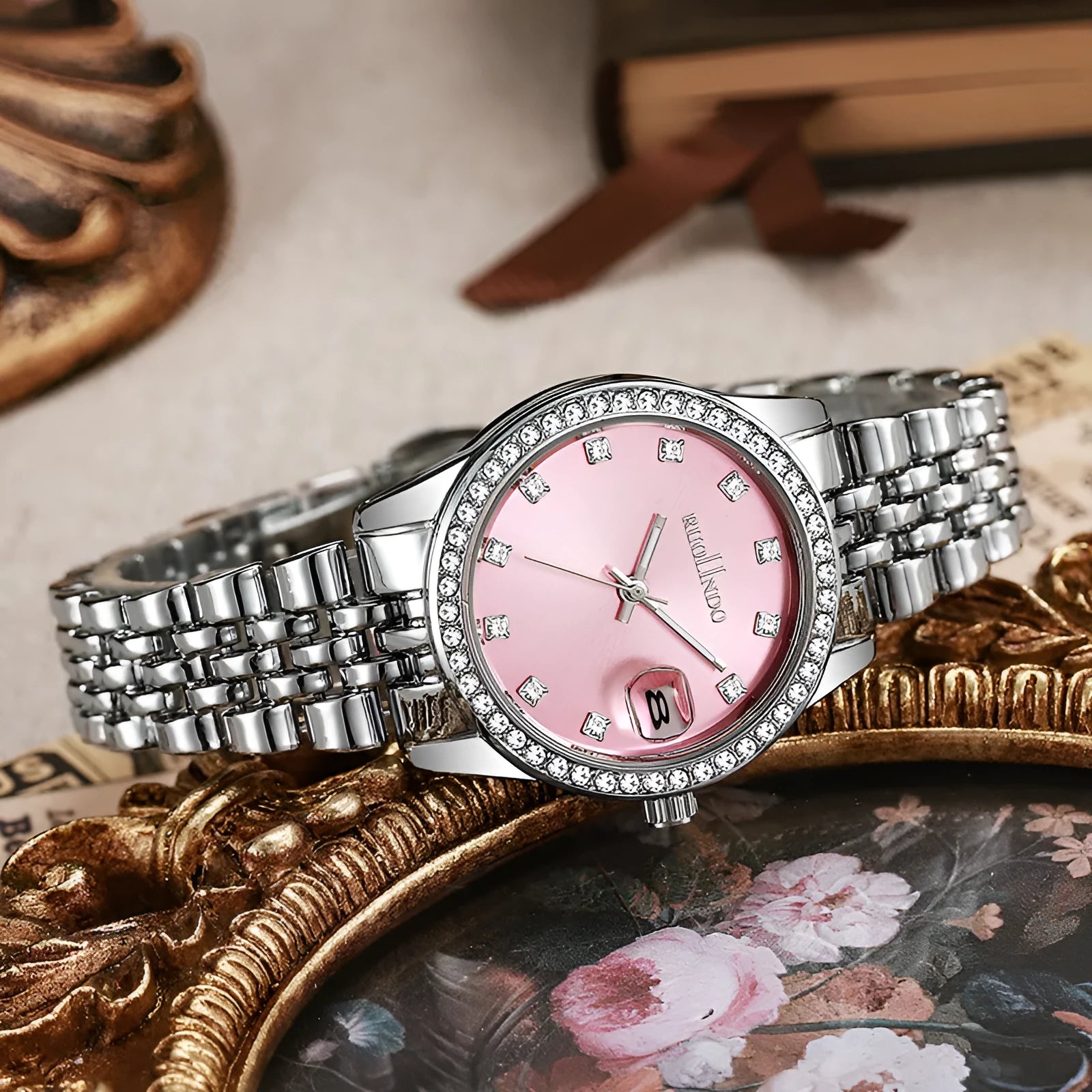 Women's silver alloy quartz fashion watch with circular dial and stainless steel buckle on wrist