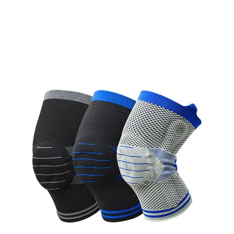 A cotton knee pad with a visible silicone massage spring bar shock absorber, shown in a grey and blue colour combination.
