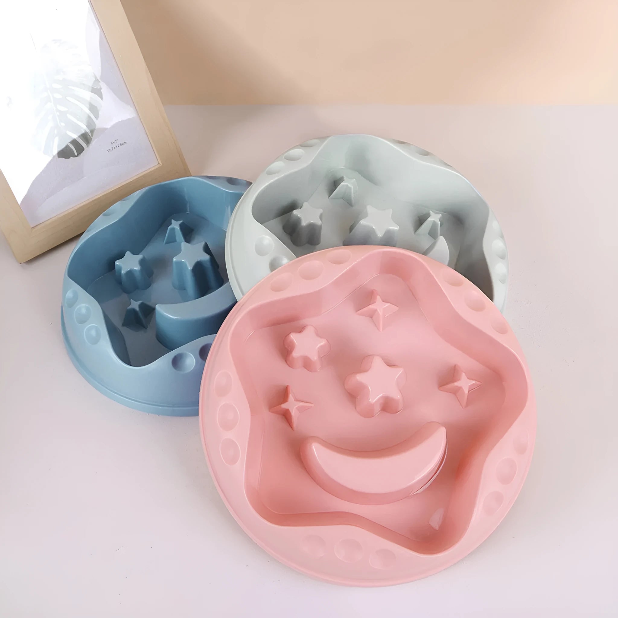 Moon Star Wings large slow-feeding pet bowl in blue, showing internal raised centre and wing design