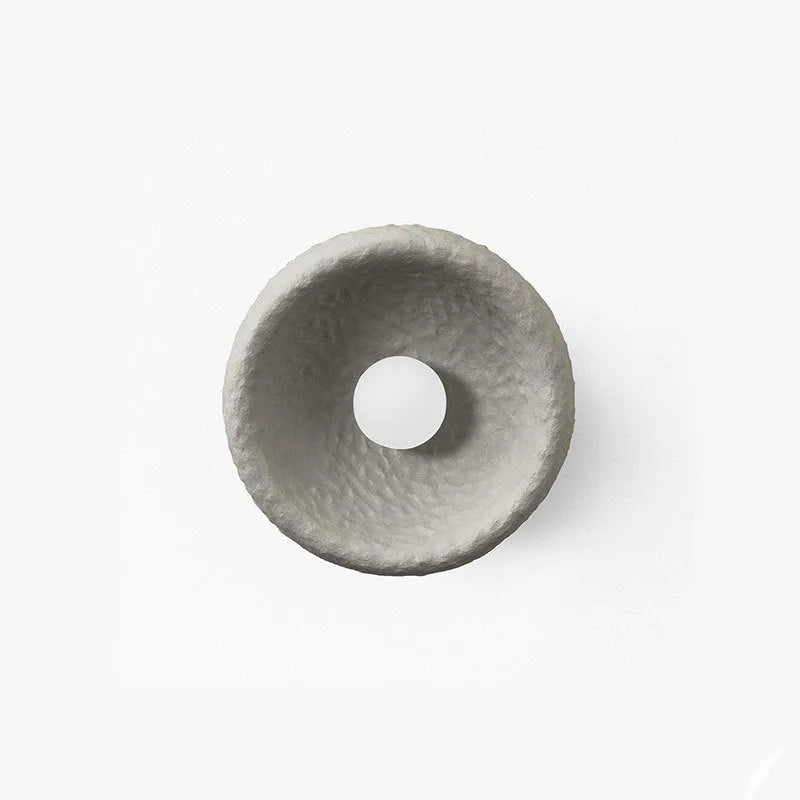 Japanese-style modern simple wall lamp with a round resin shade in warm white light.