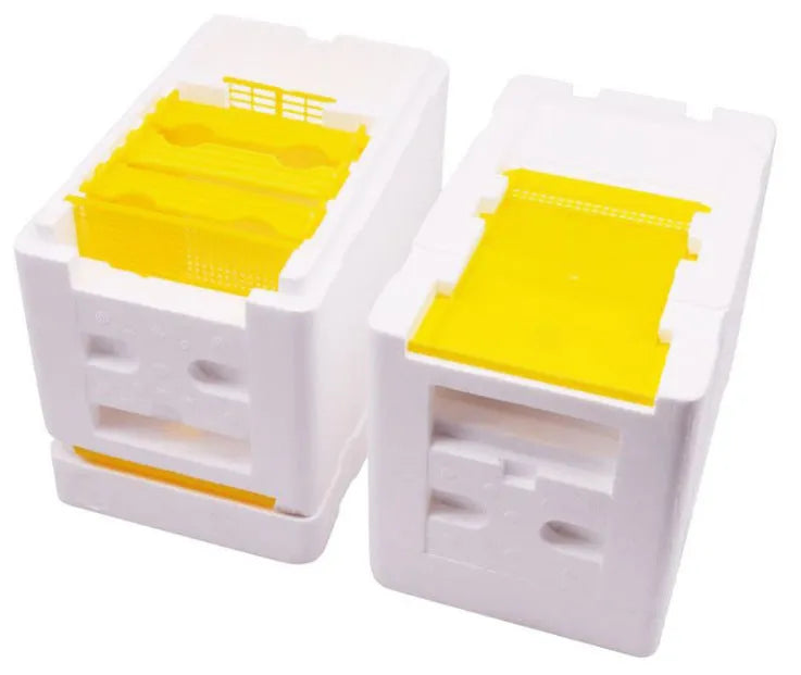 Three white EPS foam mini delivery boxes for bee mating and breeding arranged on a flat surface
