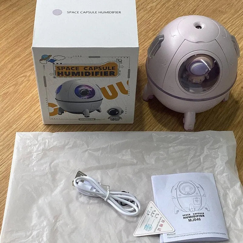 Astronaut-themed USB desktop humidifier with purple casing and colourful LED lighting