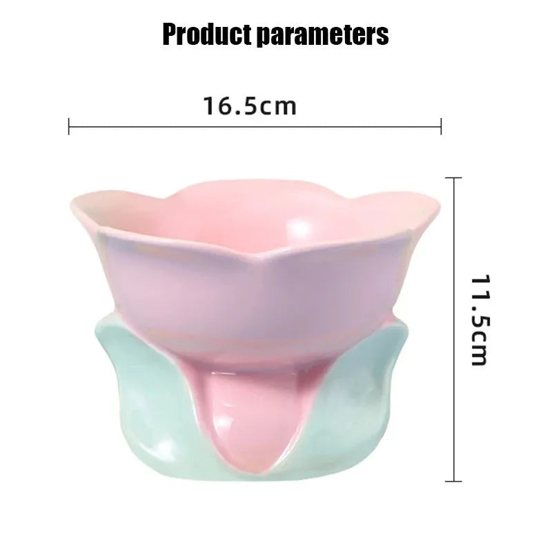 Blue ceramic raised pet bowl with floral pattern and non-slip base for cat or small dog.