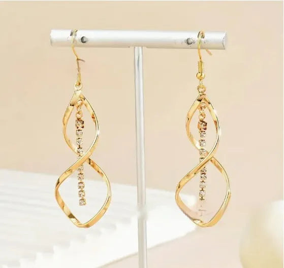 Gold spiral geometric earrings with ellipse diamond-style ornament for women