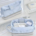 Polyester folding double-layer pencil case in dark blue, blue, and cream white colour options.