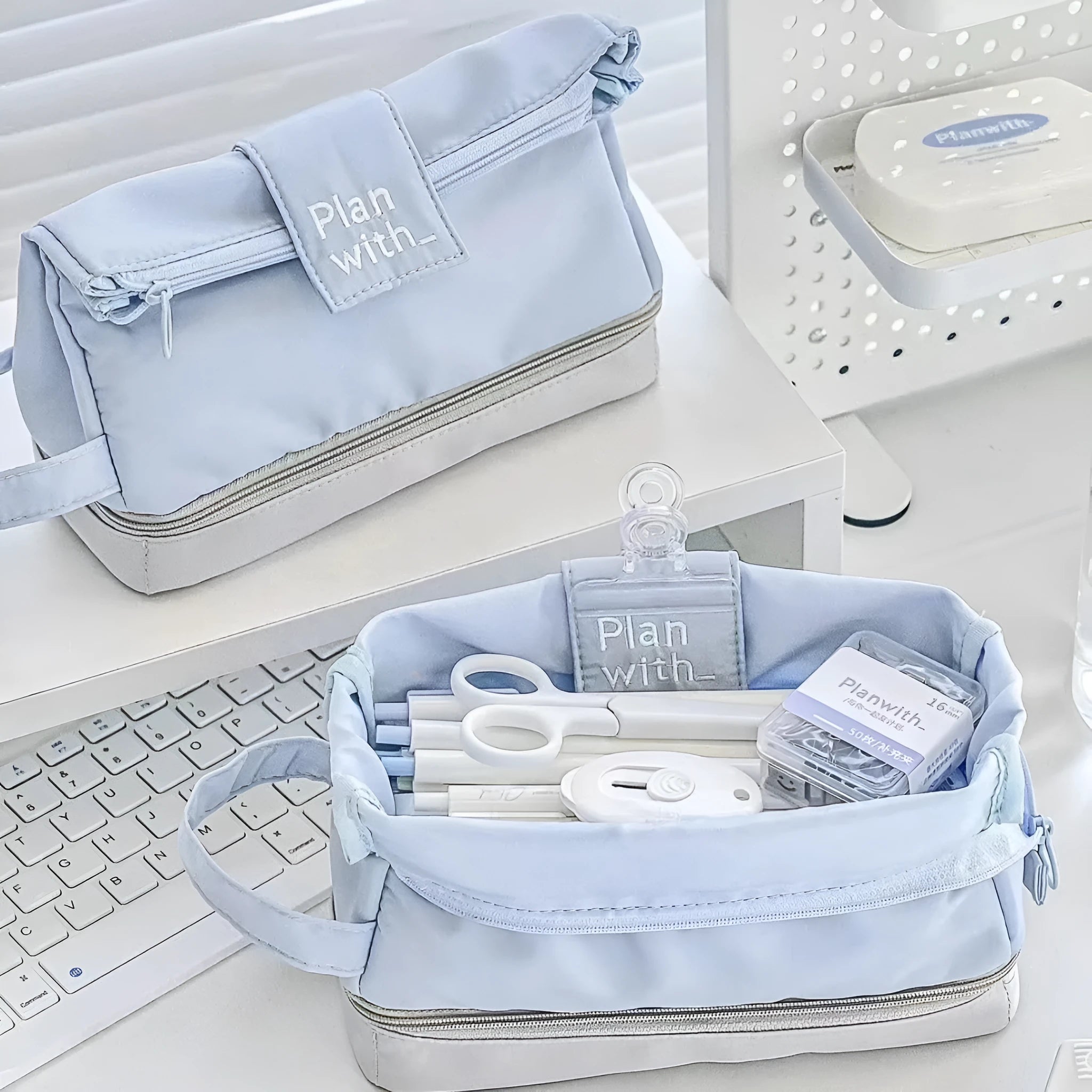 Polyester folding double-layer pencil case in dark blue, blue, and cream white colour options.