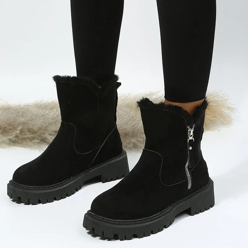 Women's black faux suede snow boots with thick plush lining and side zip closure