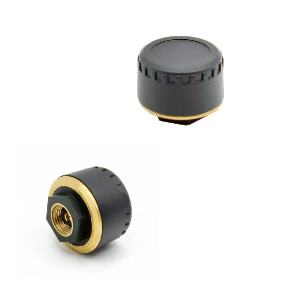 Four black Bluetooth tyre pressure sensors for car with mobile phone app display