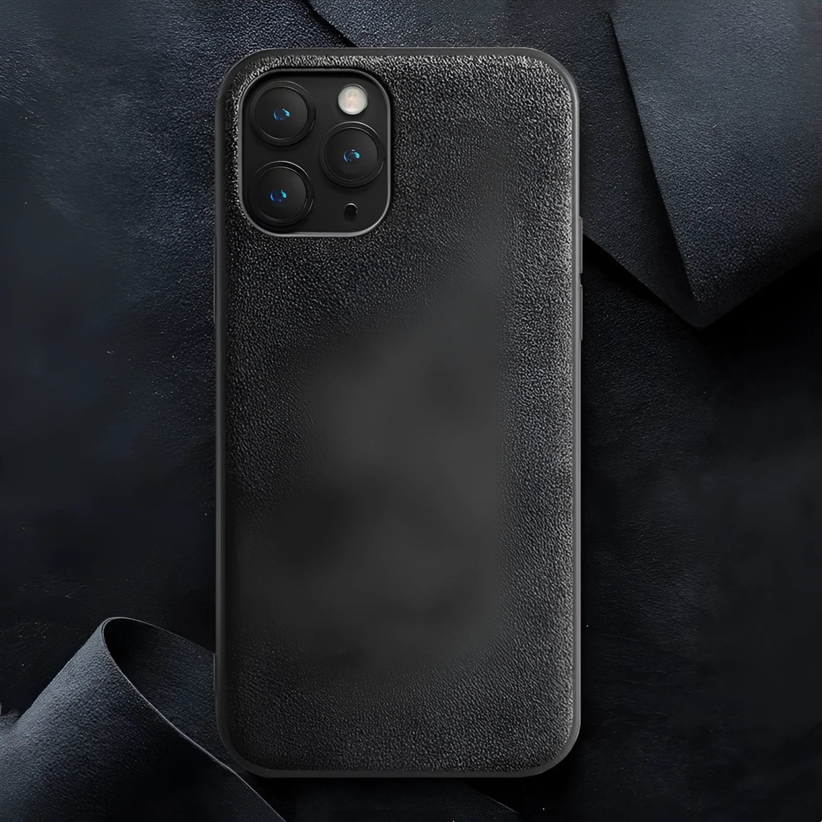 Luxury suede full-cover phone case for iPhone on a dark background, shown in elegant black colour.